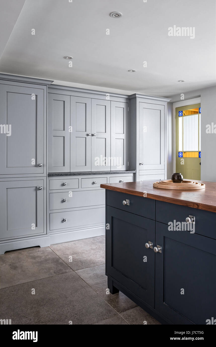 Chic Martin Moore units in kitchen with stone floors from Fired Earth Stock Photo