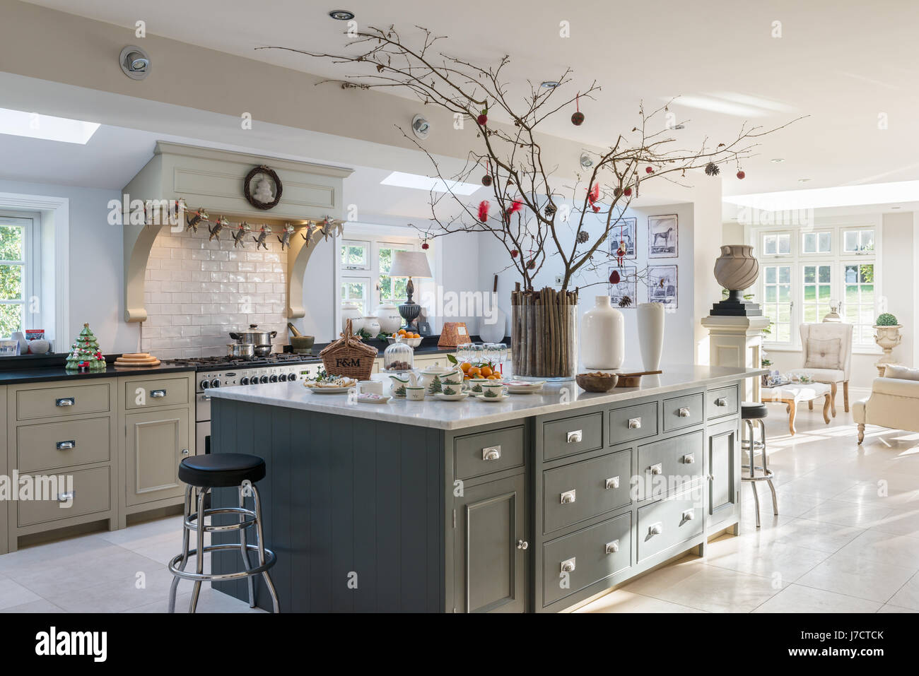 Spacious kitchen island unit with Christmas decorations in 18th century Georgian home Stock Photo