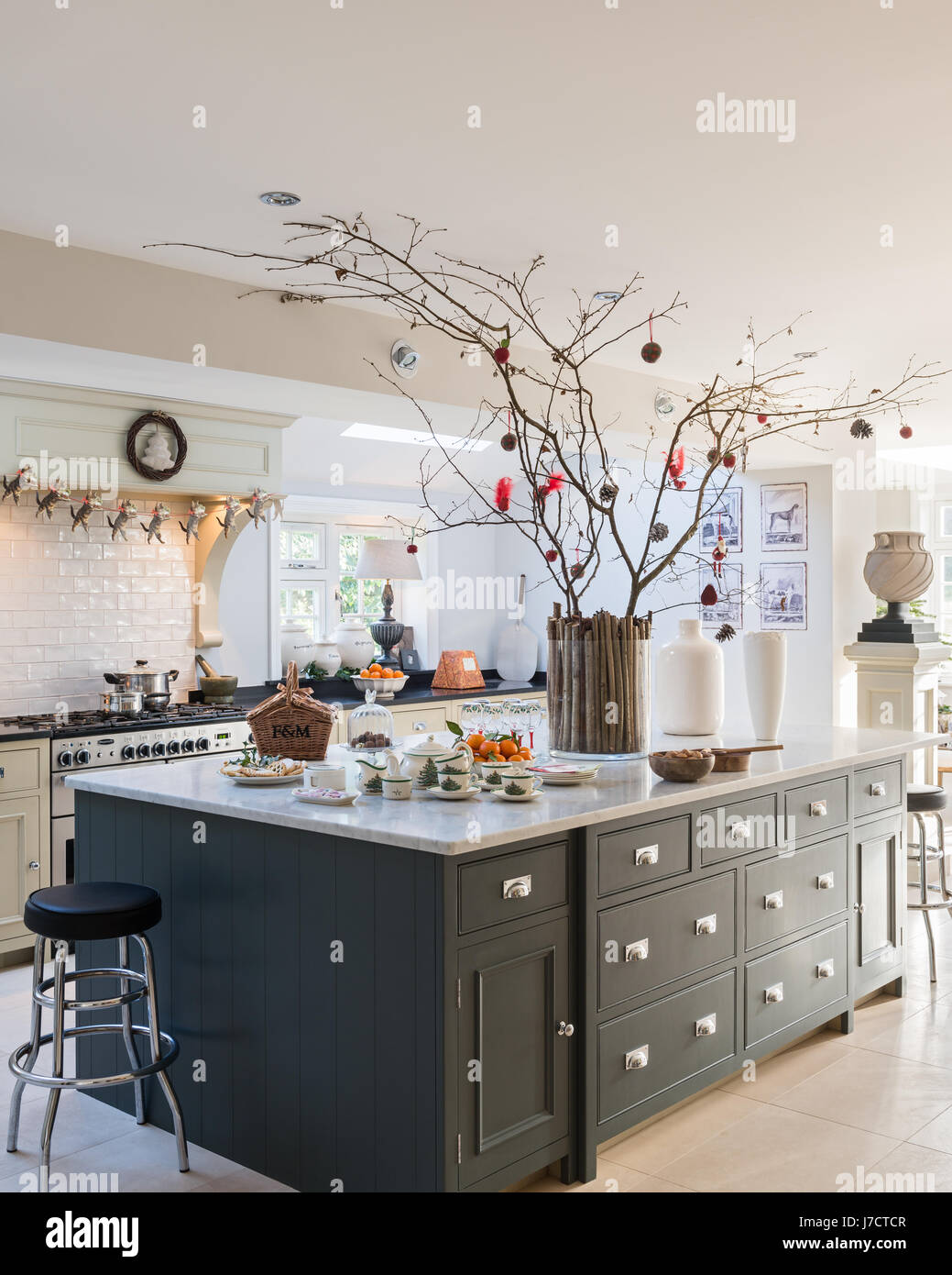 Spacious kitchen island unit with Christmas decorations in 18th century Georgian home Stock Photo
