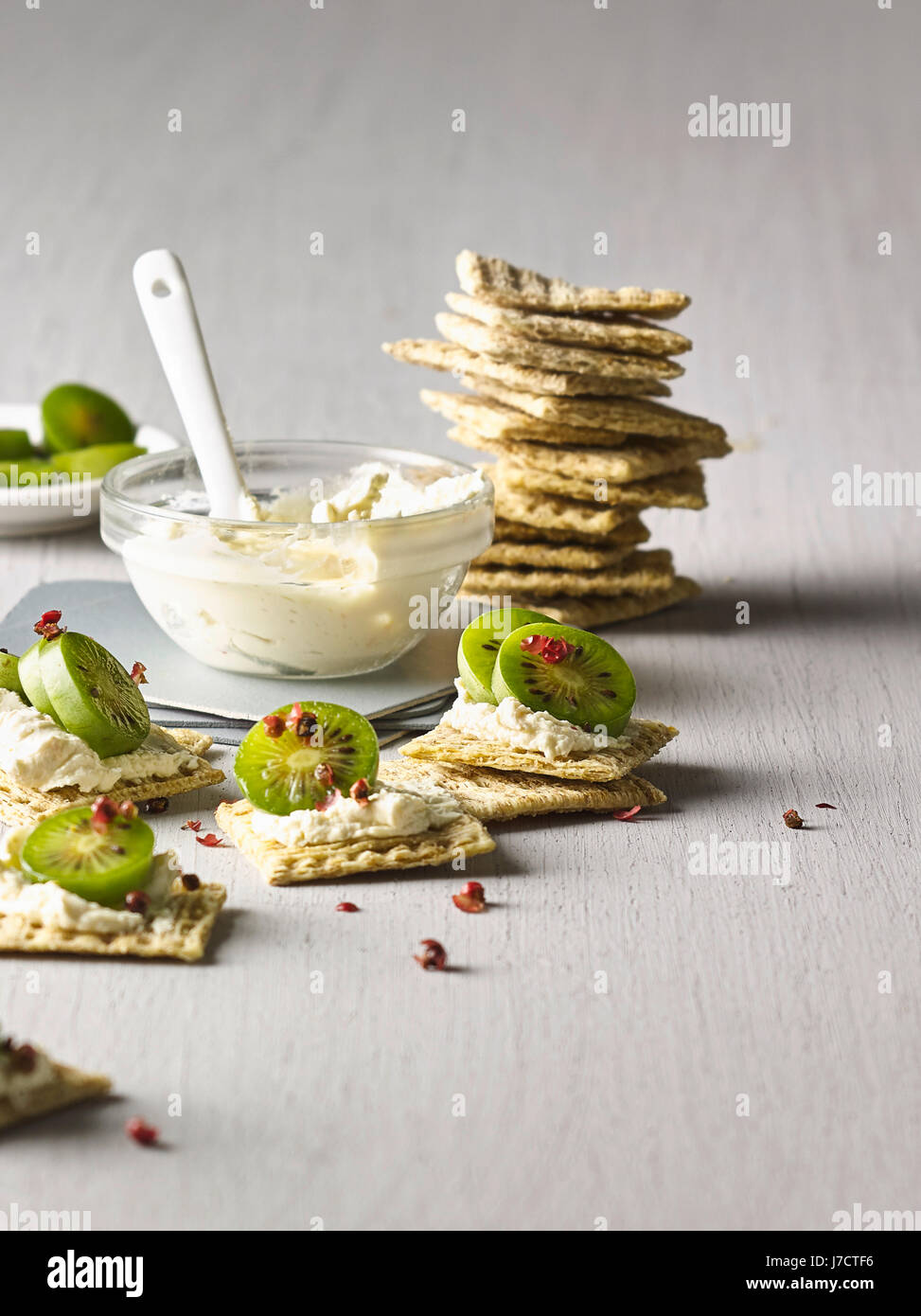 Crackers with nergi berries and cream cheese Stock Photo