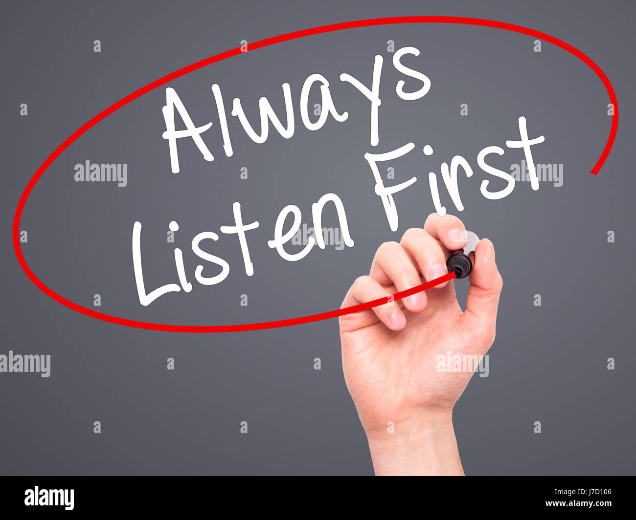 Man Hand writing Always Listen First with black marker on visual screen ...