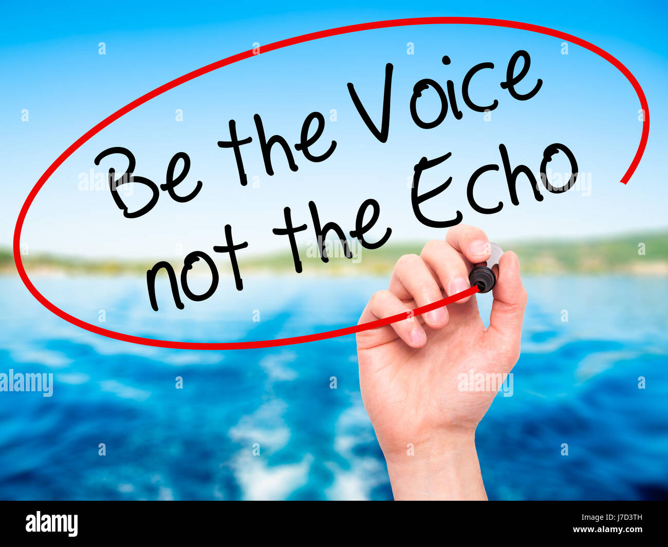 Man Hand writing Be the Voice not the Echo with black marker on visual screen. Isolated on