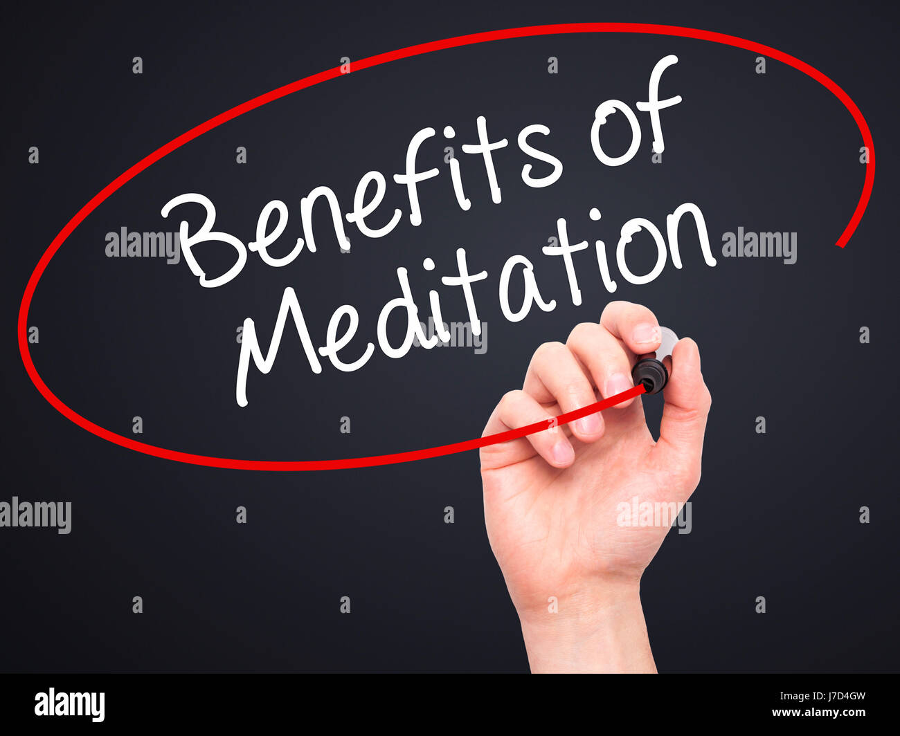 Man Hand writing Benefits of Meditation with black marker on visual screen. Isolated on