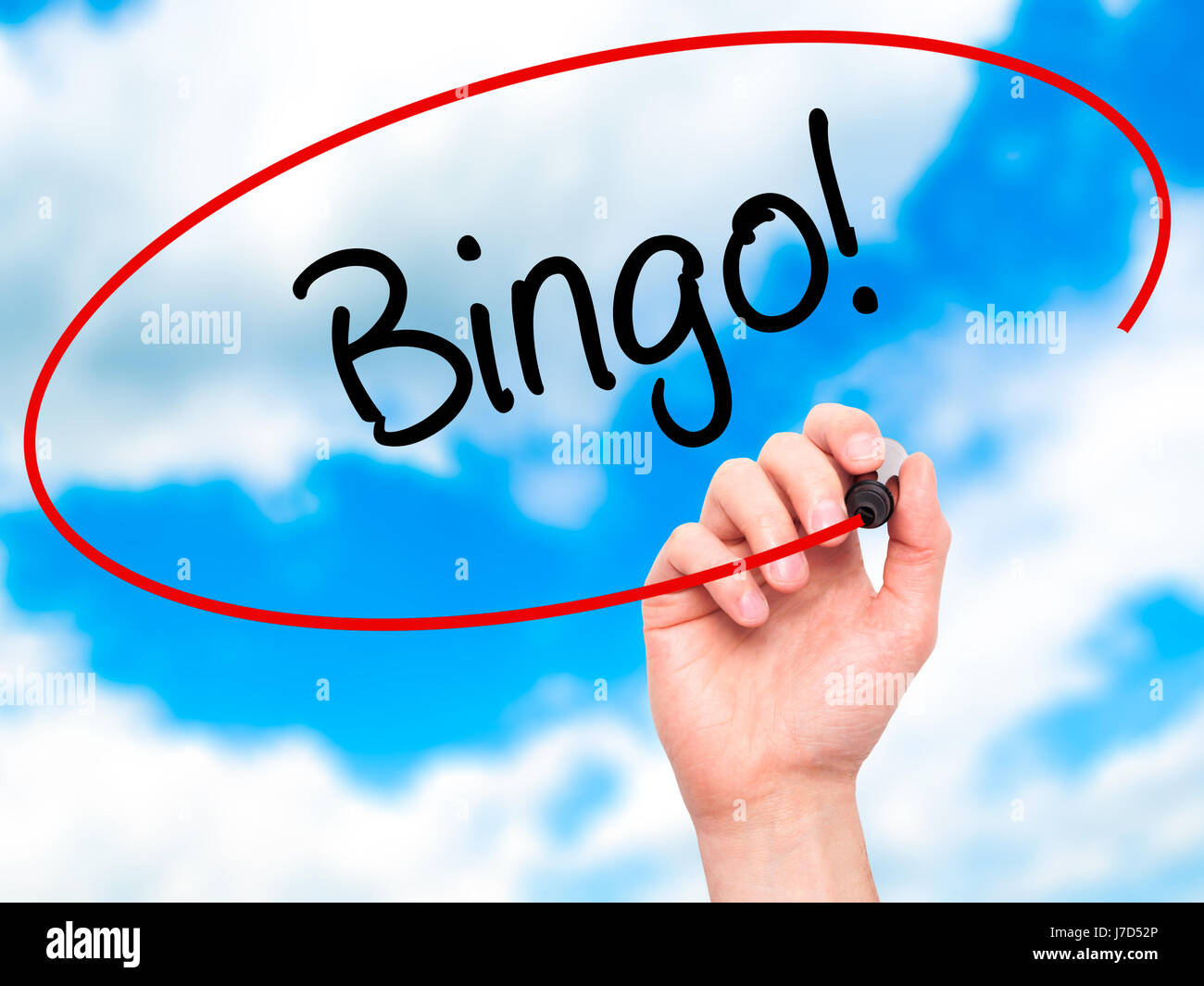 Man Hand writing Bingo! with black marker on visual screen. Isolated on background. Business, technology, internet concept. Stock Photo Stock Photo