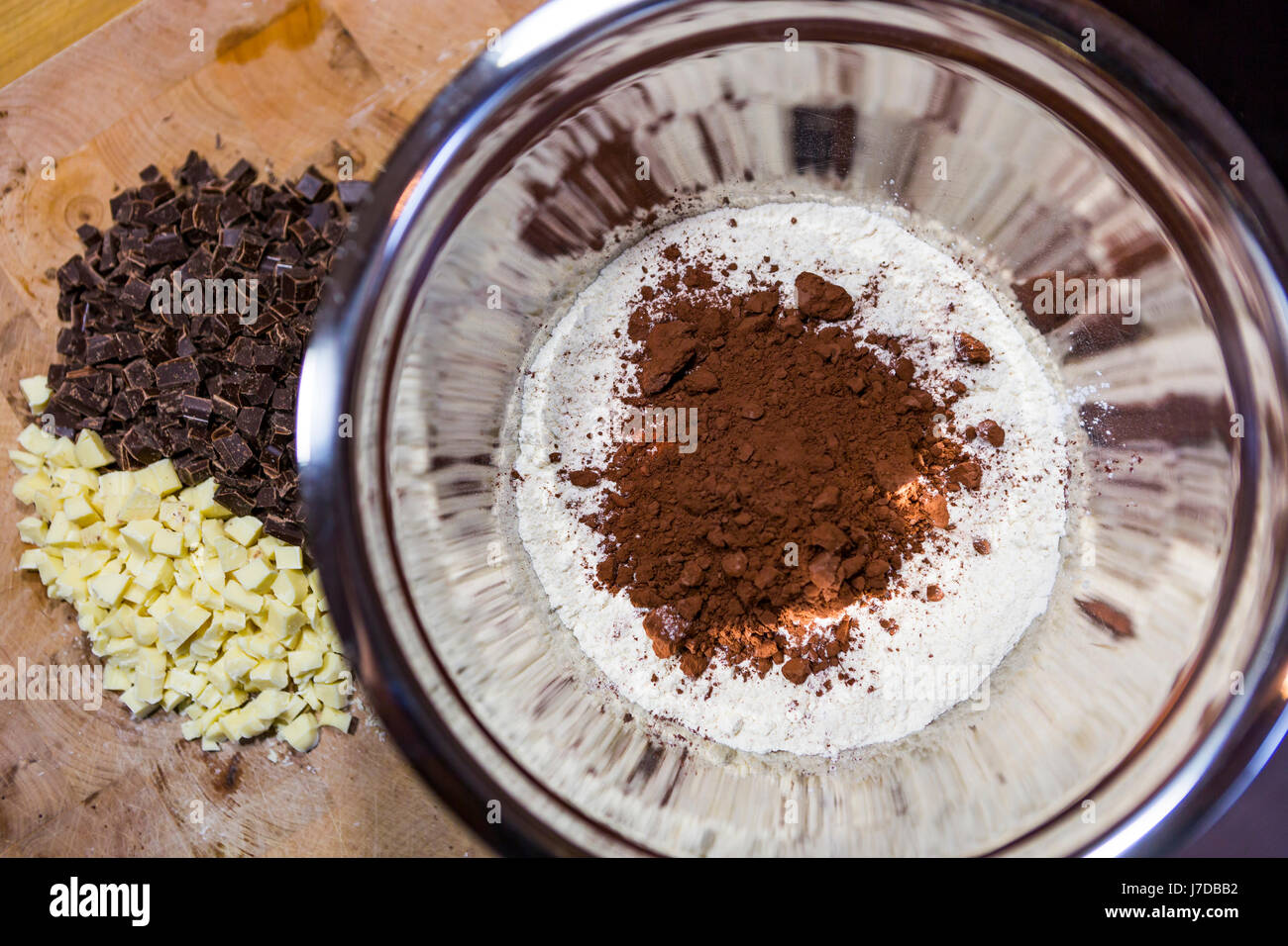 cocoa powder and  flour in a mixing bowl Stock Photo