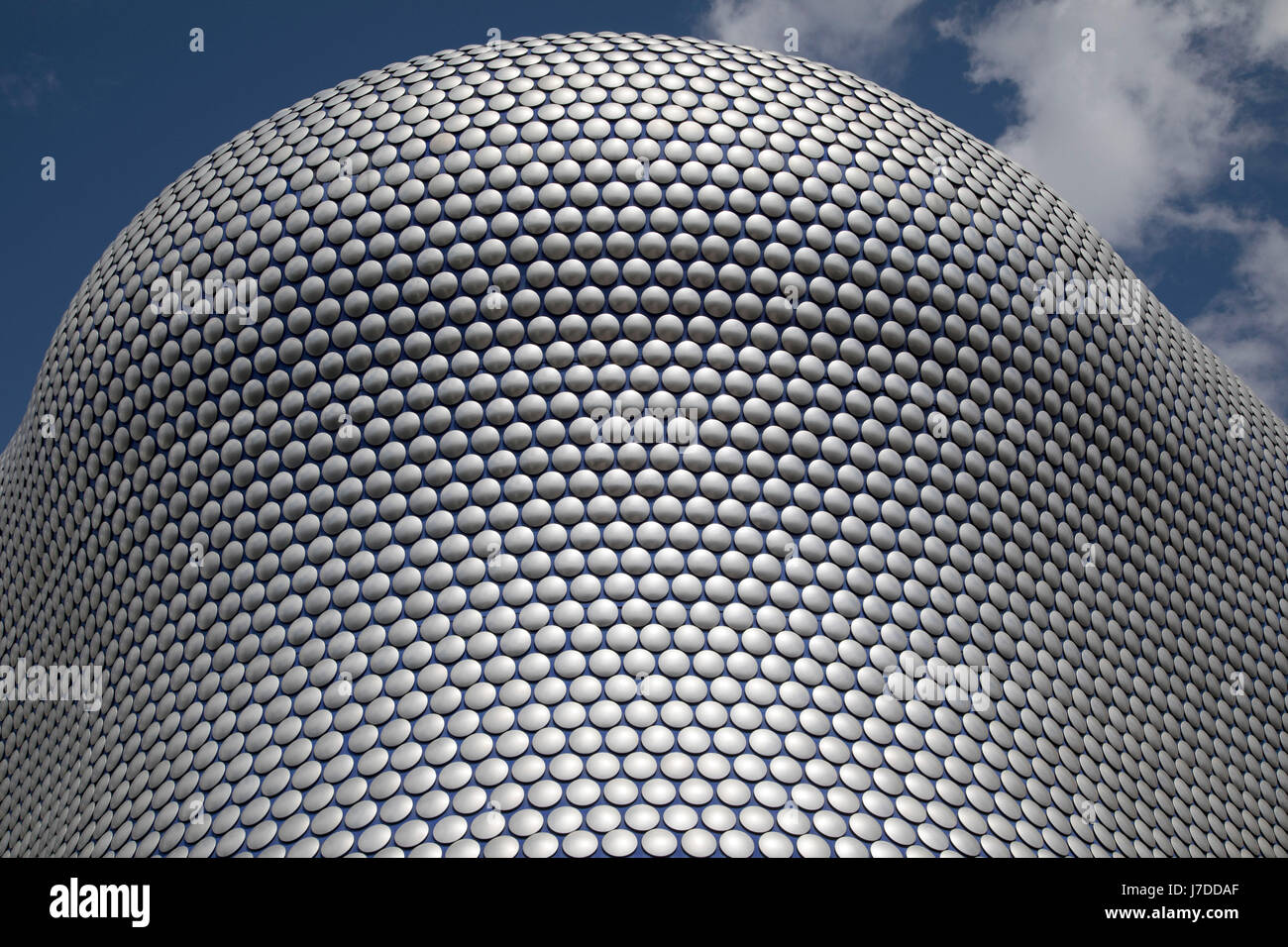 Modern landmark architecture of the Selfridges Building in Birmingham, United Kingdom. The building is part of the Bullring Shopping Centre and houses Selfridges Department Store. The building was completed in 2003 at a cost of £60 million and designed by architecture firm Future Systems. It has a steel framework with sprayed concrete facade. Since its construction, the building has become an iconic architectural landmark and seen as a major contribution to the regeneration of Birmingham. Stock Photo