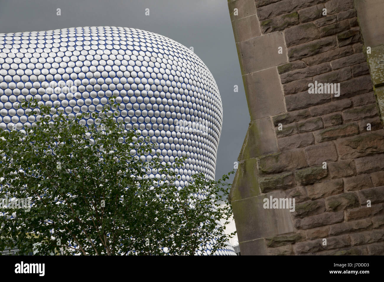 Modern landmark architecture of the Selfridges Building in Birmingham, United Kingdom. The building is part of the Bullring Shopping Centre and houses Selfridges Department Store. The building was completed in 2003 at a cost of £60 million and designed by architecture firm Future Systems. It has a steel framework with sprayed concrete facade. Since its construction, the building has become an iconic architectural landmark and seen as a major contribution to the regeneration of Birmingham. Stock Photo