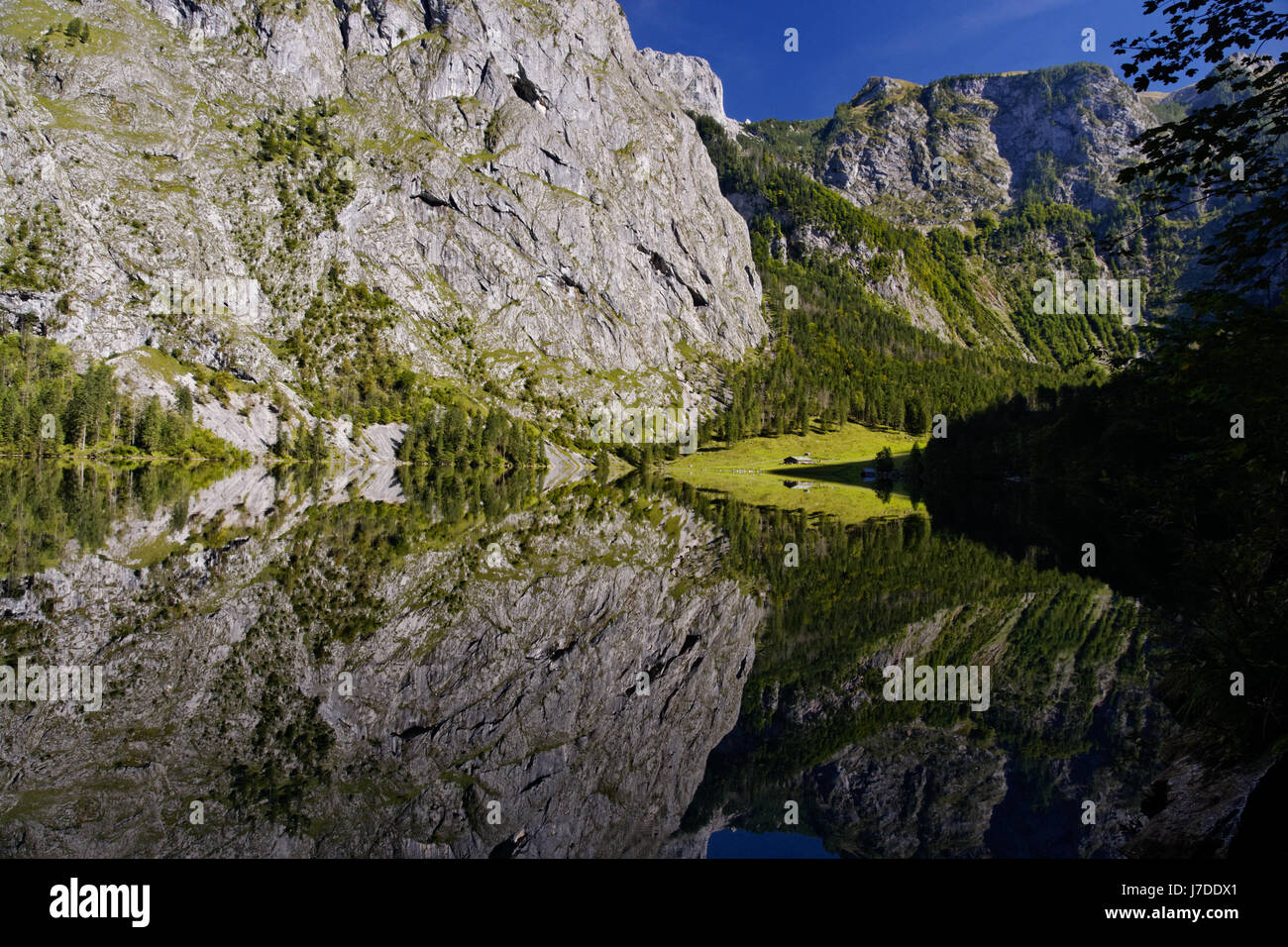 reflection on the crystal clear water in the heart of the obersee nationalpar Stock Photo