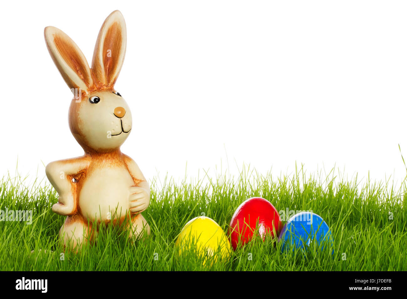 easter bunny with easter eggs in grass Stock Photo