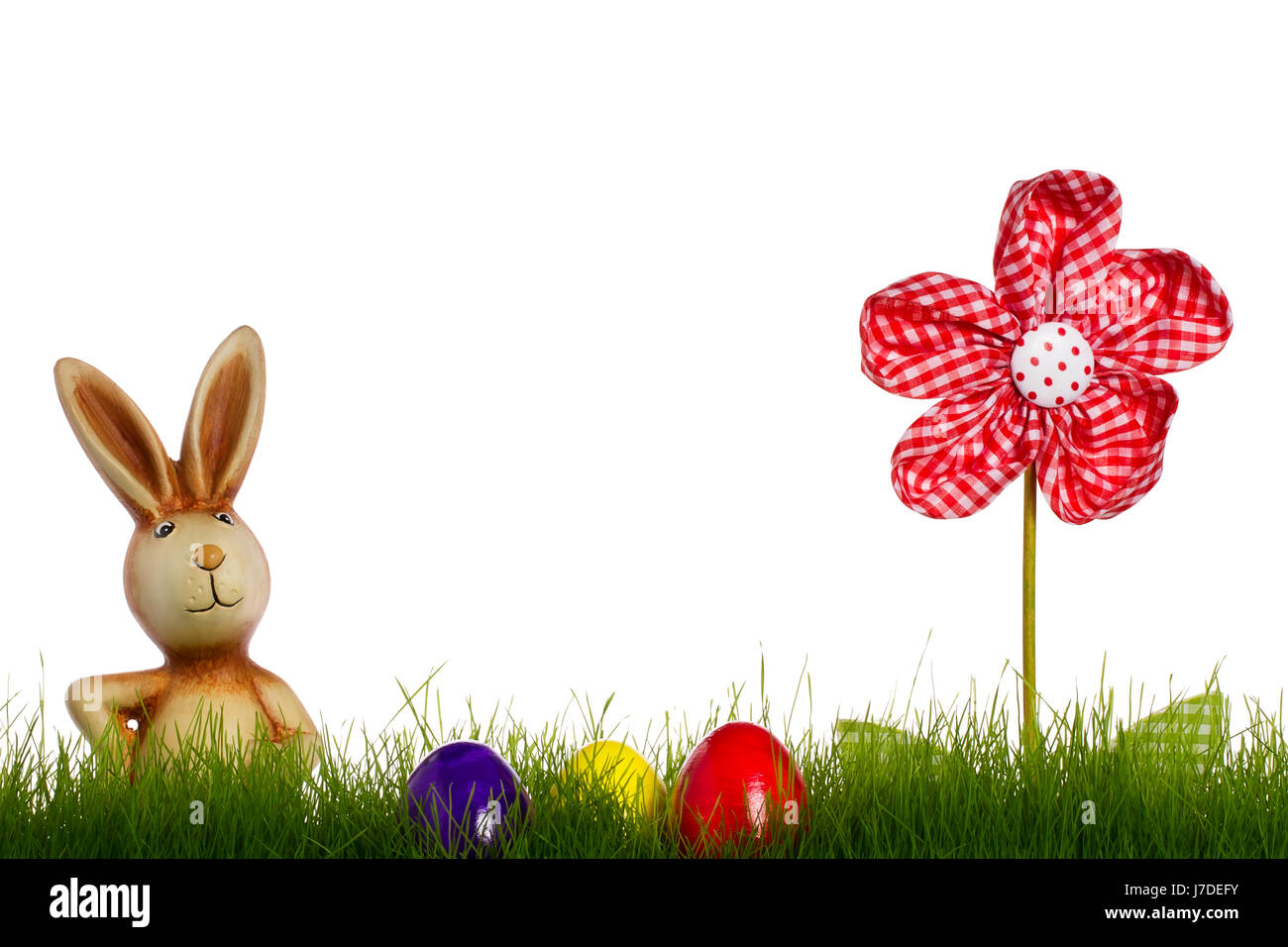 easter bunny with easter eggs in grass and sto Stock Photo - Alamy