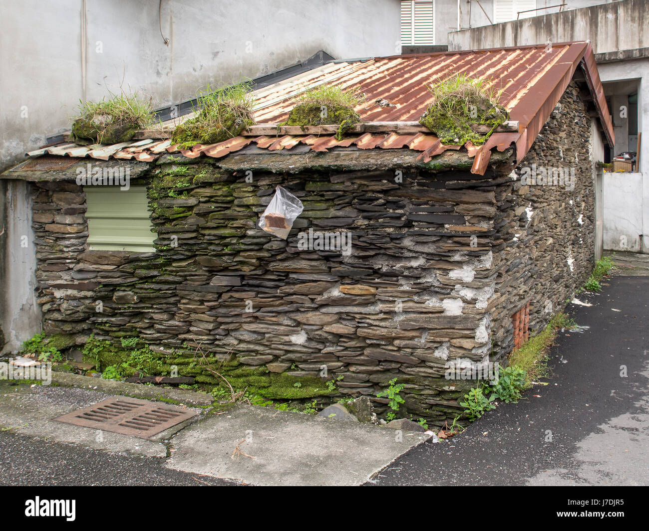 Ilan, Taiwan - October 13, 2016: Wall home built with black, flat stones Stock Photo