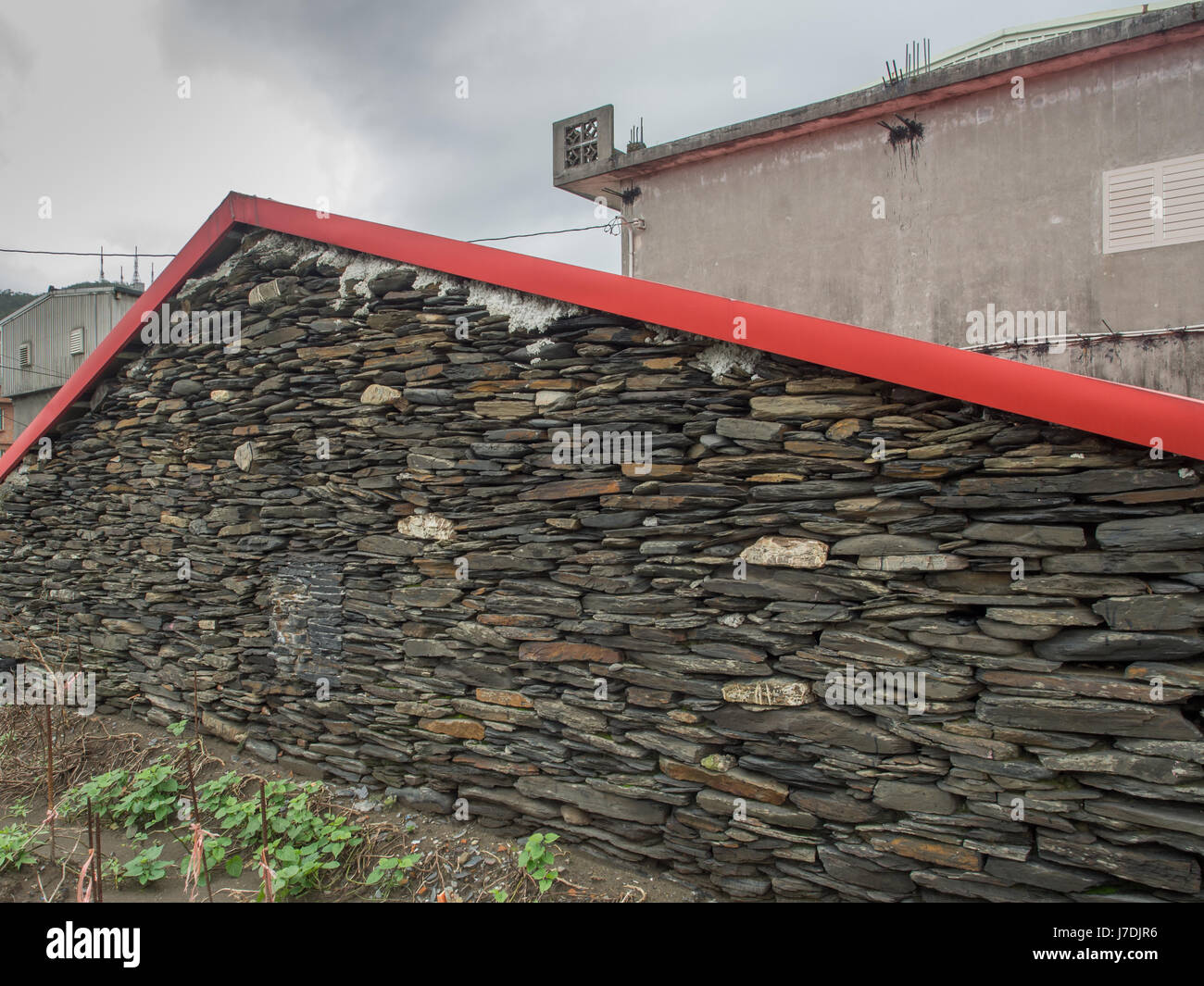 Ilan, Taiwan - October 13, 2016: Wall home built with black, flat stones Stock Photo