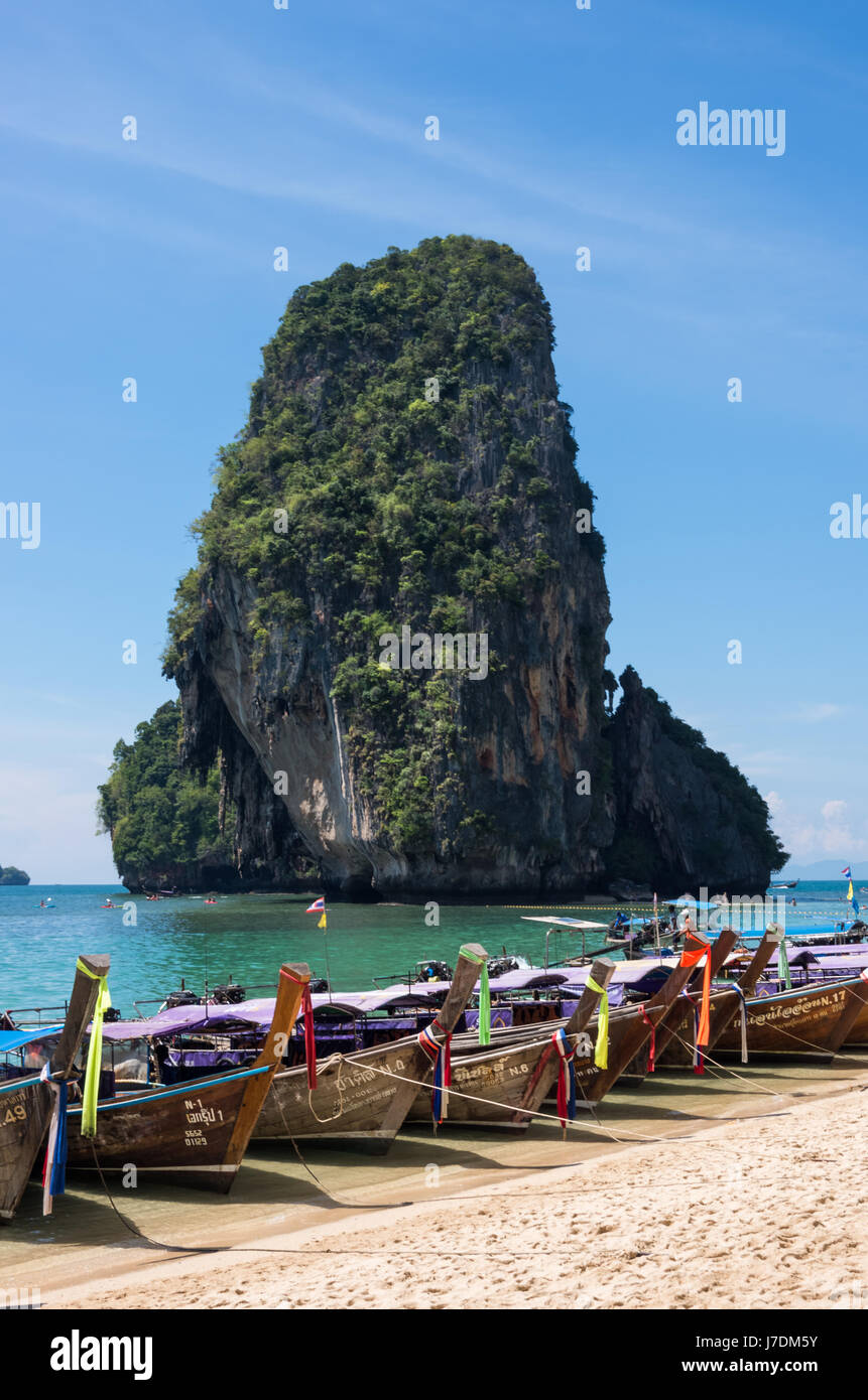 Long-tail boats and karst rock formation at Phra Nang Beach, Railay, Krabi, Thailand Stock Photo