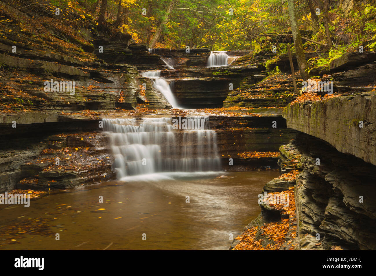 A Buttermilk Creek cascade along the Buttermilk Creek Gorge near Ithaca, New York in the fall. USA Stock Photo