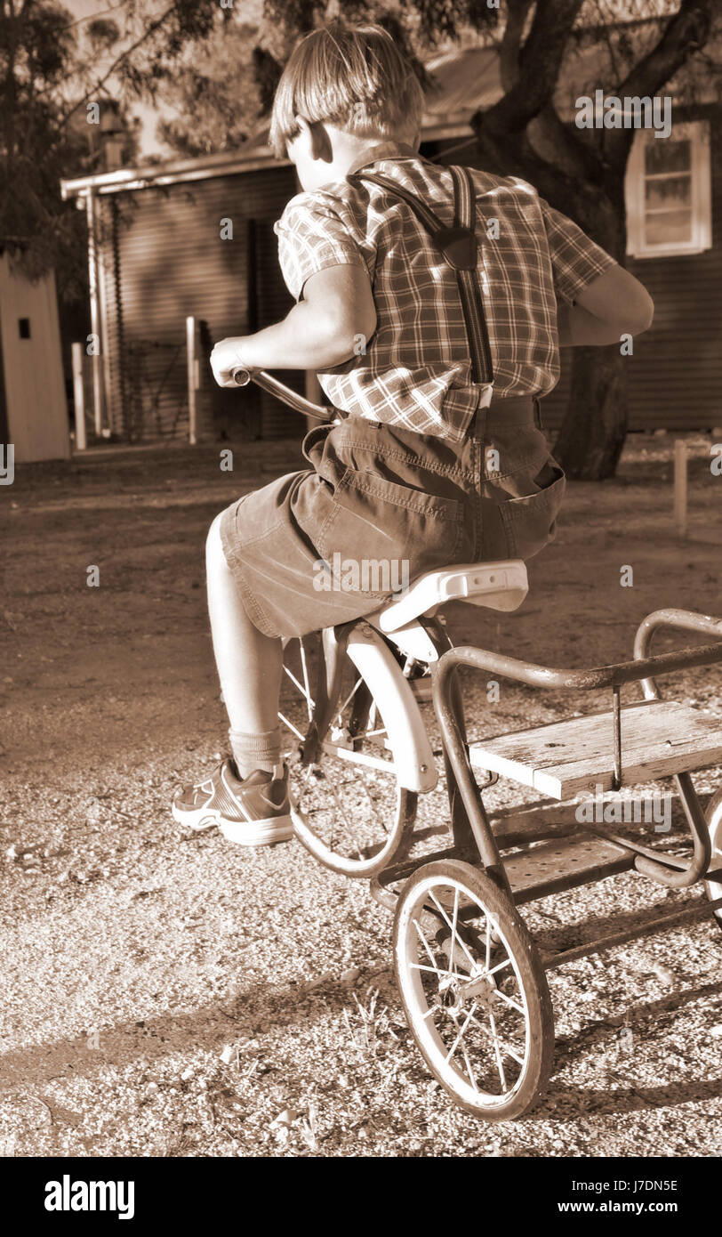 fashion ride antique sepia bw vintage toy photo camera riding photograph Stock Photo