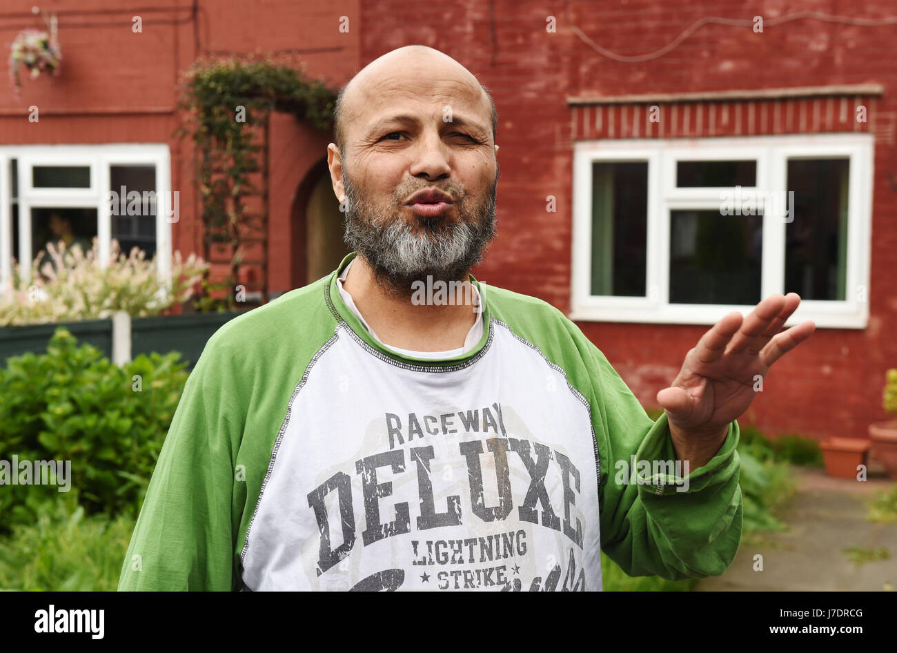 Neighbour Omar Alfakhuri who witnessed a police raid at an address in Aston Avenue, Greater Manchester, after a suicide bomber killed 22 people leaving a pop concert at the Manchester Arena on Monday night. Stock Photo
