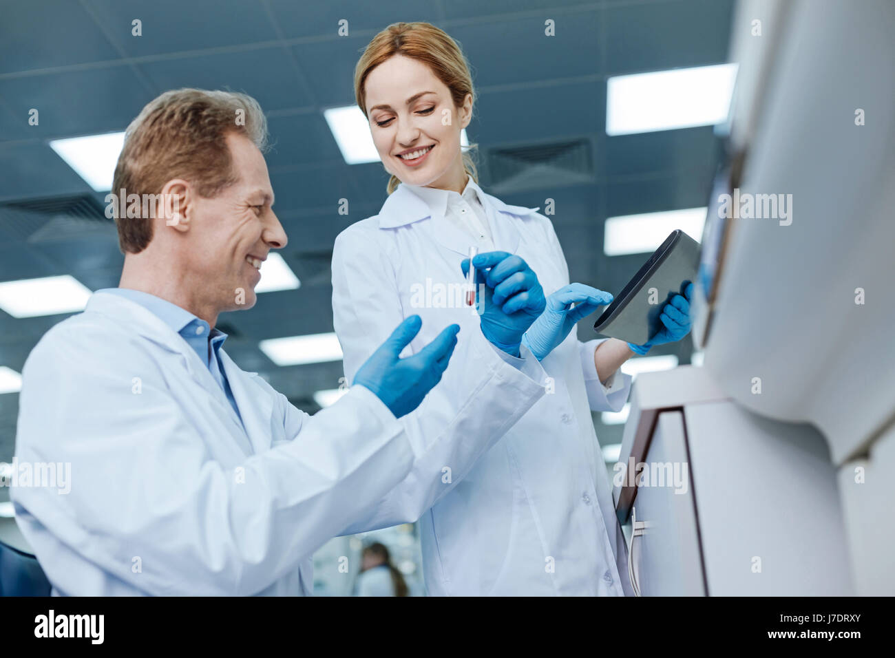 Low angle photo of delighted medical workers during discussion Stock Photo