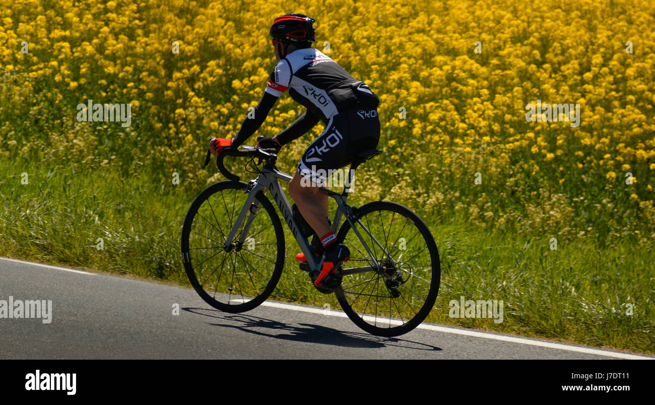Helmeted cyclist hi-res stock photography and images - Alamy