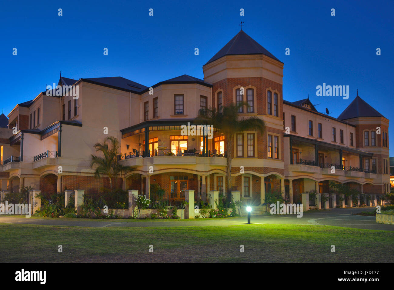 Twilight illuminates a modern Australian apartment housing complex. North Fremantle, Western