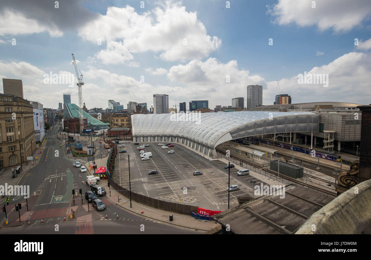 A general view of the Manchester Arena (right), Victoria railway station and a closed Corporation Street after a suicide bomber killed 22 people leaving a pop concert at the venue on Monday night. Stock Photo