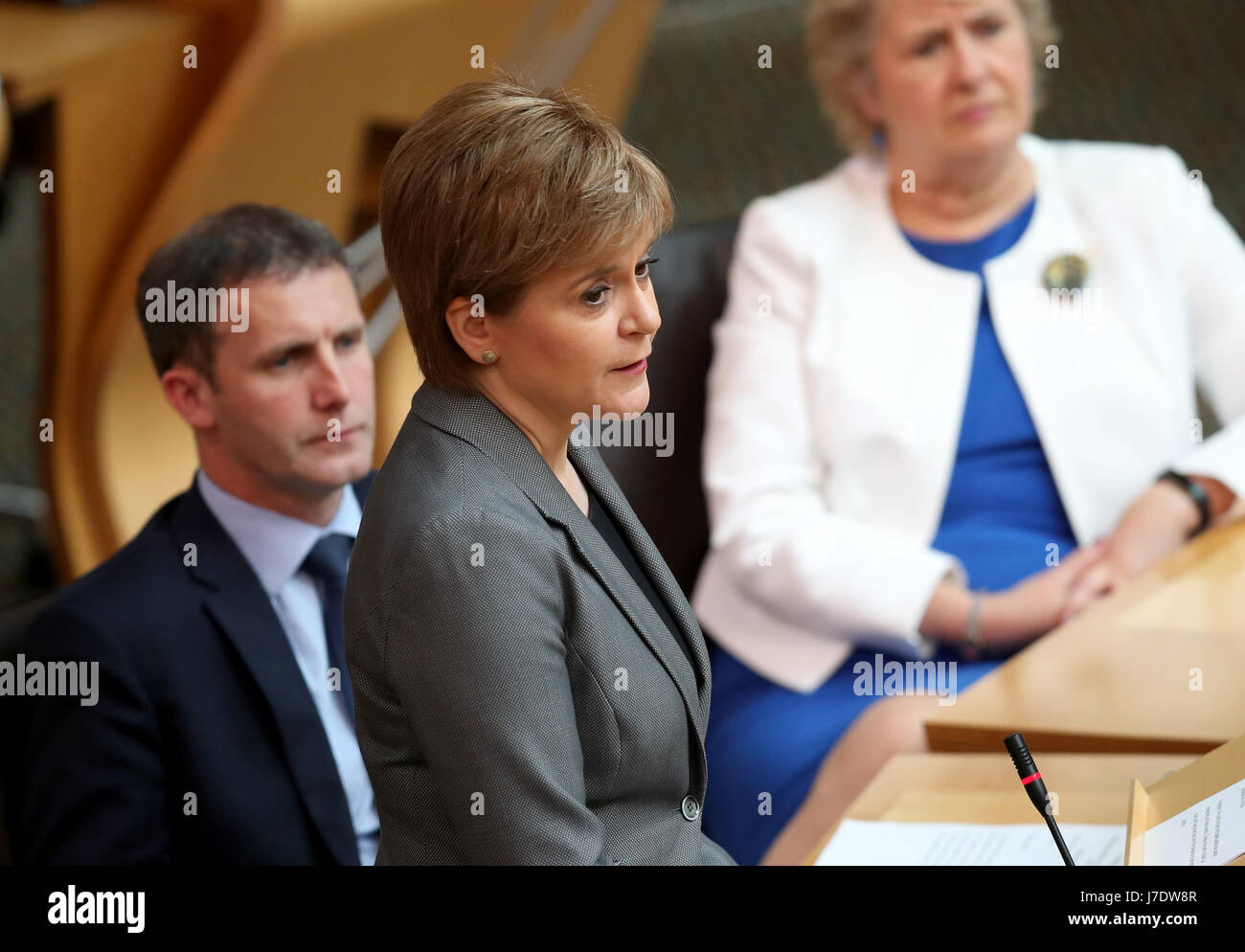 First Minister Nicola Sturgeon delivers her Security in Scotland statement to MSPs in the main chamber of the Scottish Parliament, Edinburgh. Following confirmation that the UK's terror threat level has been raised to critical the First Minister chaired another meeting of the Resilience Committee earlier in the day. Stock Photo