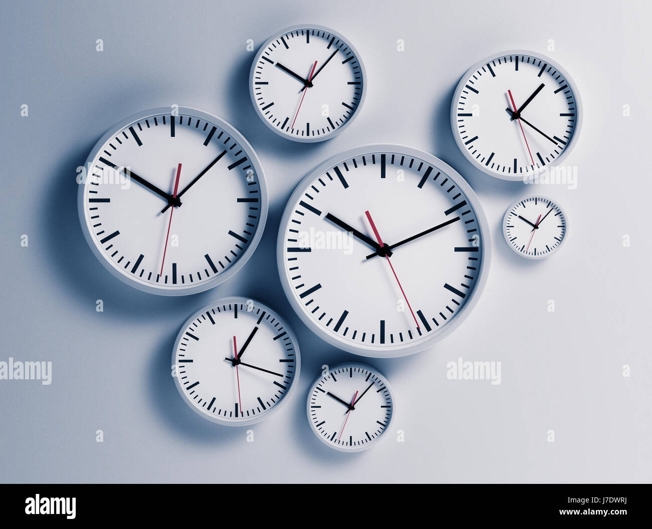 Clocks hanging at the wall isolated on white Stock Photo Alamy