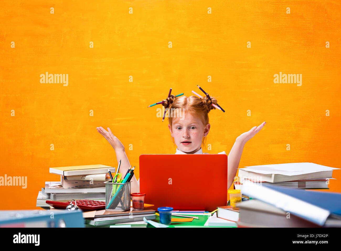 The Redhead teen girl with lot of books at home. Studio shot Stock ...