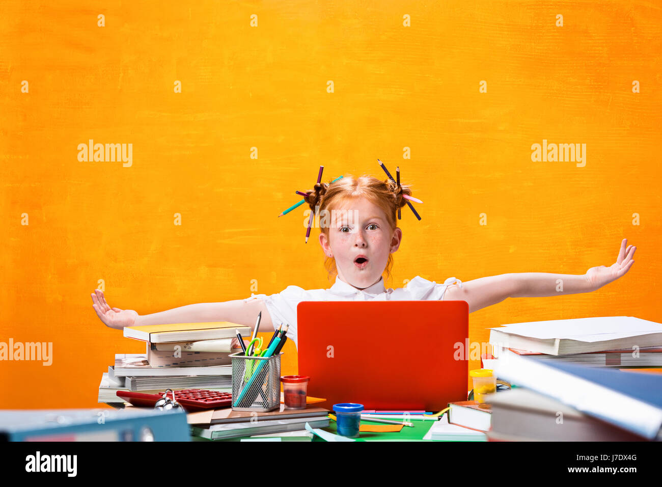 The Redhead teen girl with lot of books at home. Studio shot Stock ...