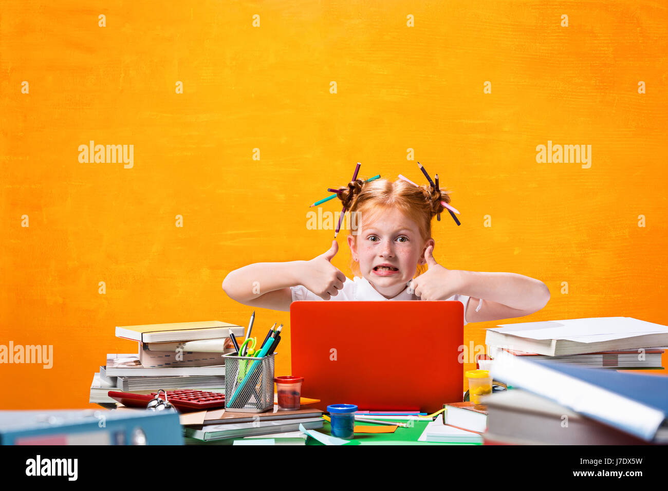 The Redhead teen girl with lot of books at home. Studio shot Stock ...