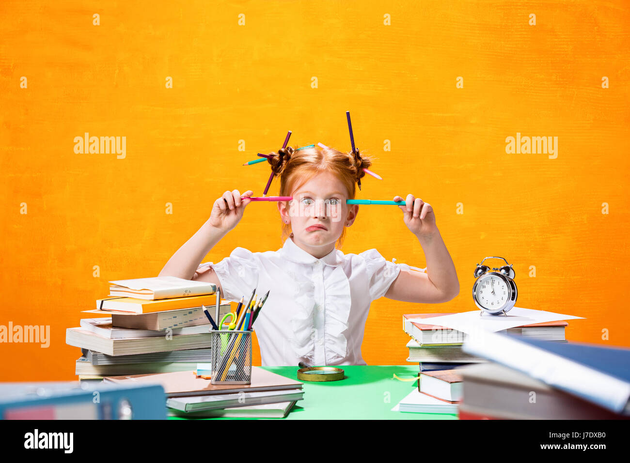 The Redhead teen girl with lot of books at home. Studio shot Stock ...