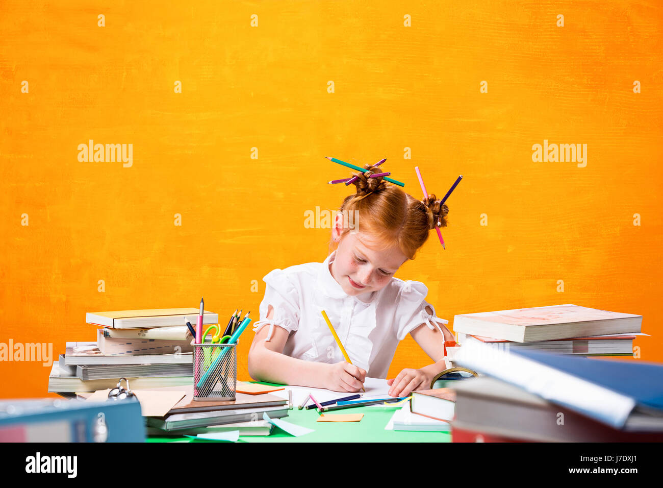 The Redhead teen girl with lot of books at home. Studio shot Stock ...