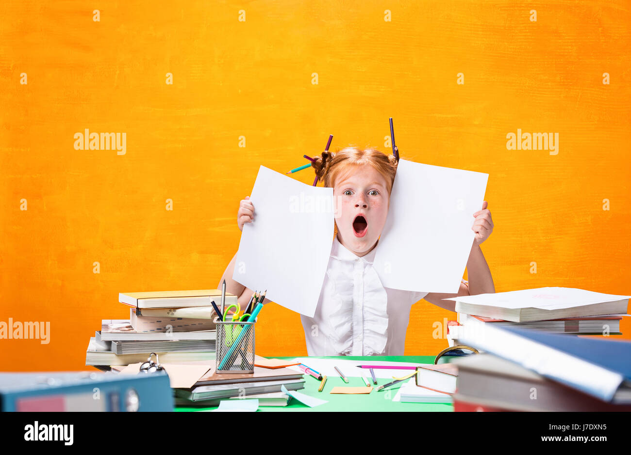 The Redhead teen girl with lot of books at home. Studio shot Stock ...