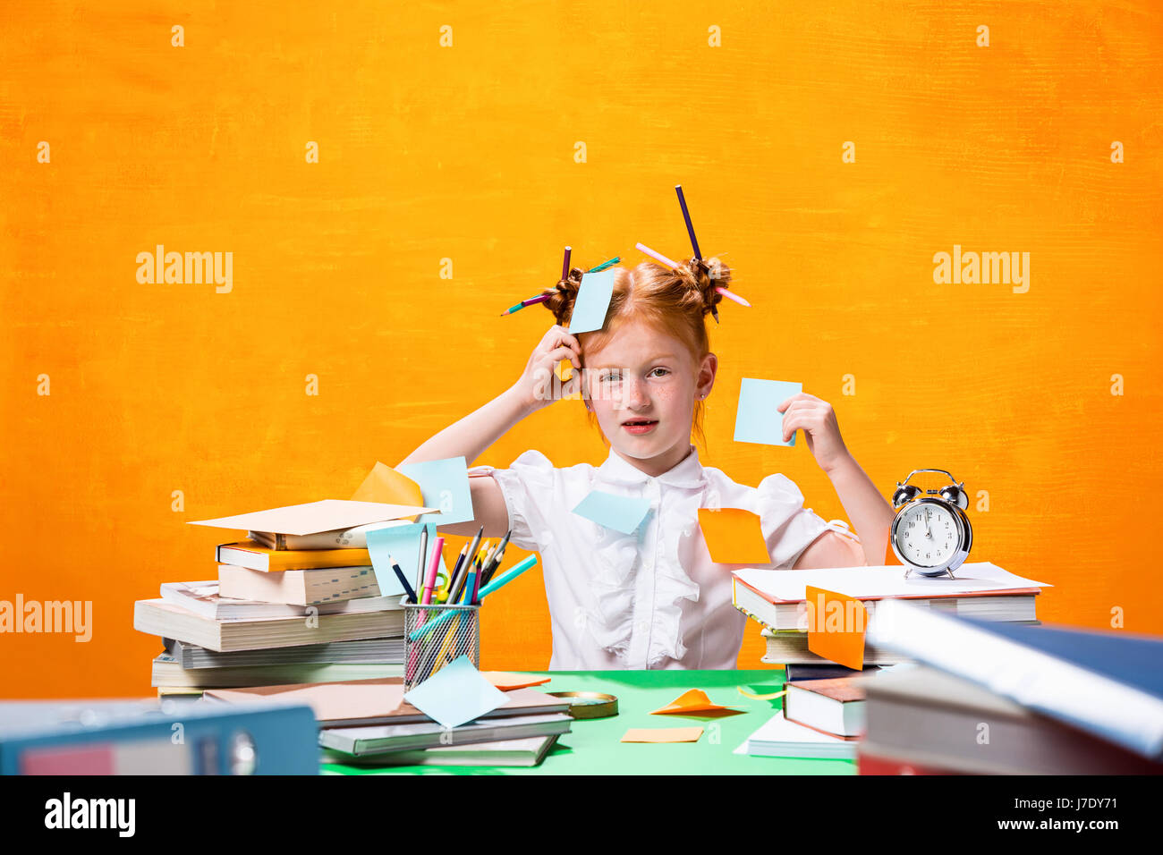 The Redhead teen girl with lot of books at home. Studio shot Stock ...
