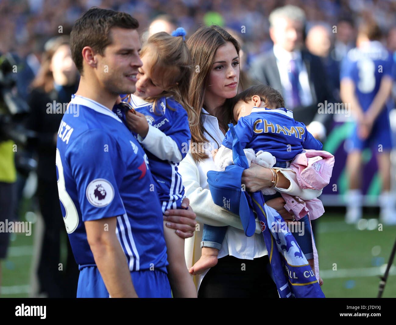Chelsea's Cesar Azpilicueta with his wife Adriana Azpilicueta and their children, daughter Martina (left) and their other child during the celebrations after the game Stock Photo