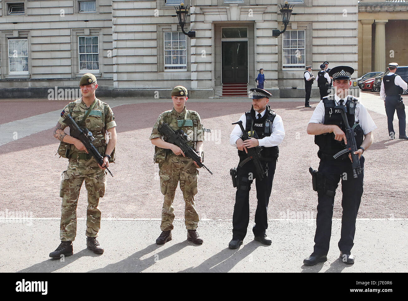 London Protection Command Soldiers join police officers outside Buckingham Palace, London, as ...