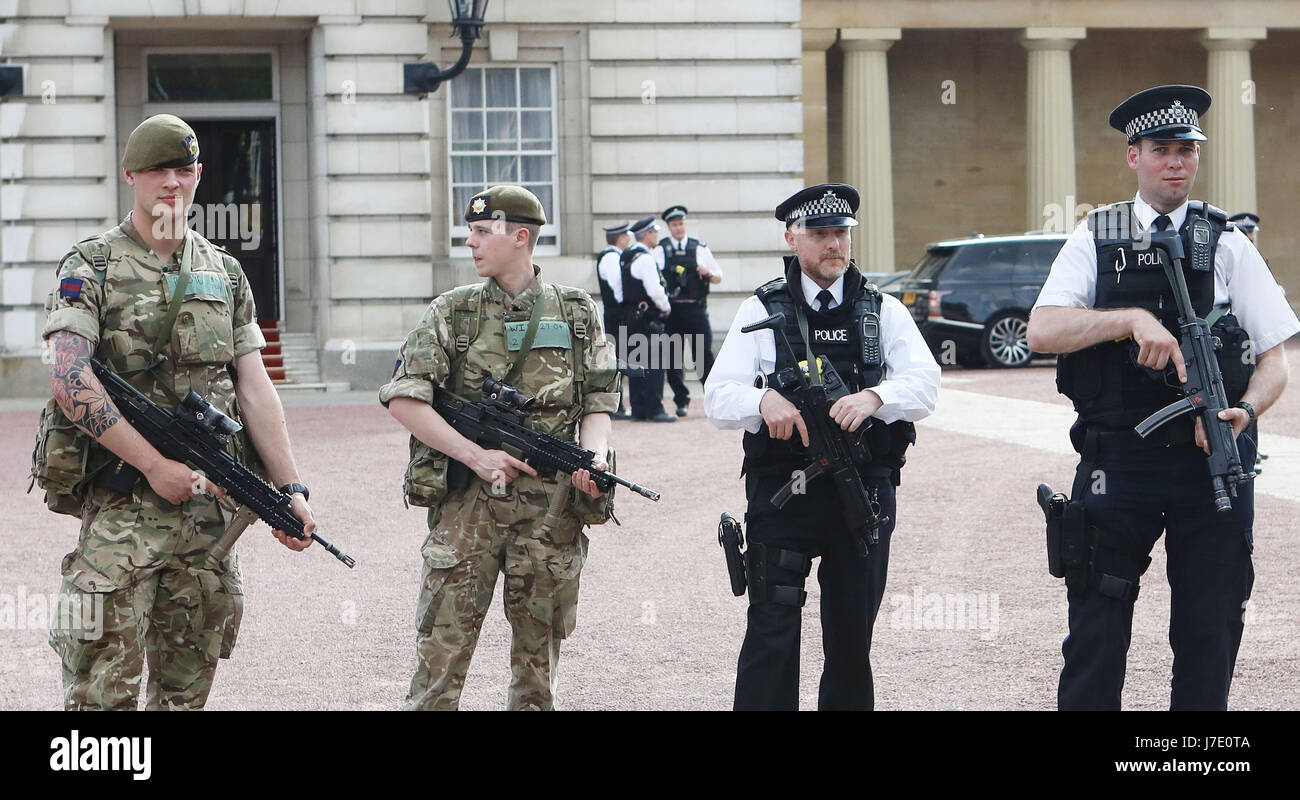 London Protection Command Soldiers join police officers outside Buckingham Palace, London, as ...