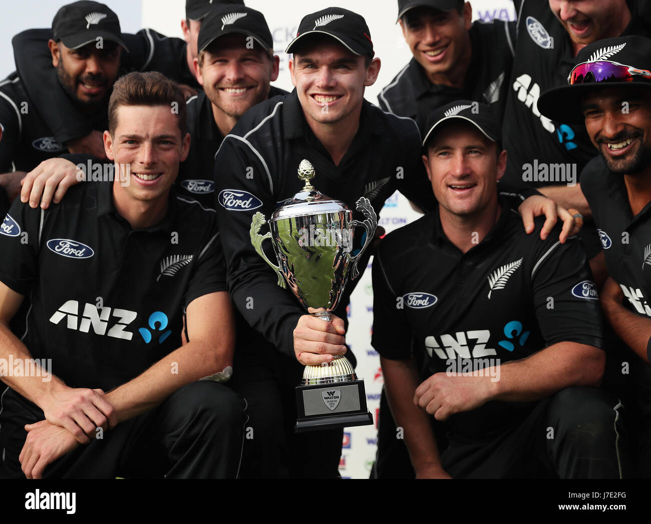 The New Zealand team captain Tom Latham and his team-mates celebrate with the trophy after winning the Tri-Nations series at Clontarf Cricket Club, Dublin. Stock Photo