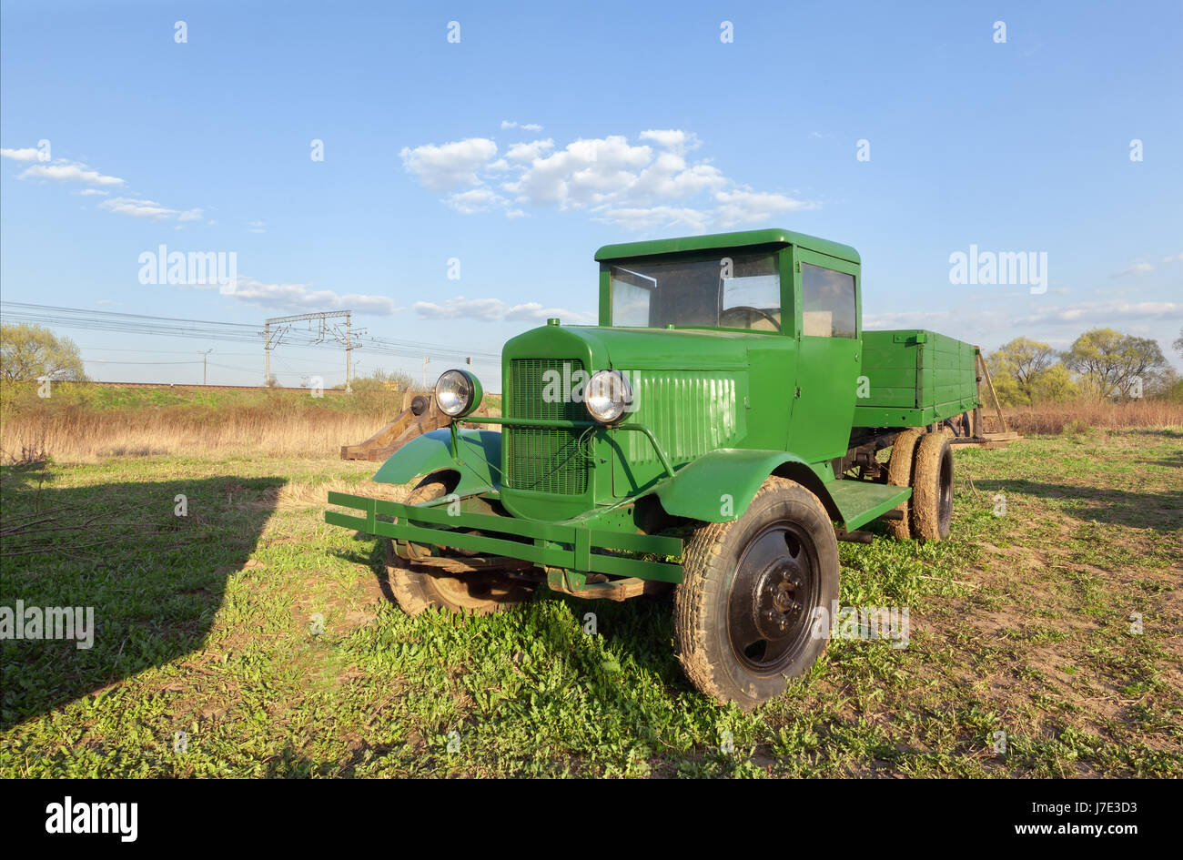 Vintage retro green soviet truck in the field Stock Photo