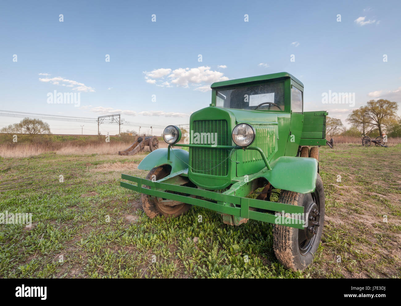 Vintage retro soviet truck green field, front view closeup Stock Photo