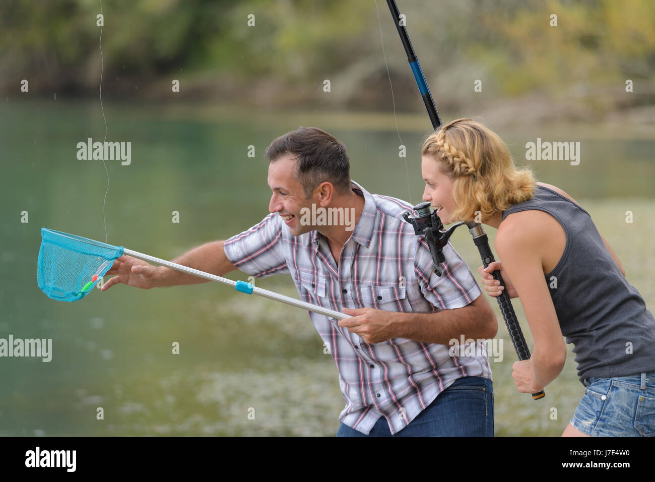 young couple fishing something Stock Photo