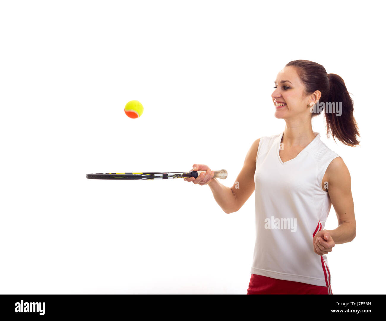 Woman playing with tennis racquet Stock Photo - Alamy