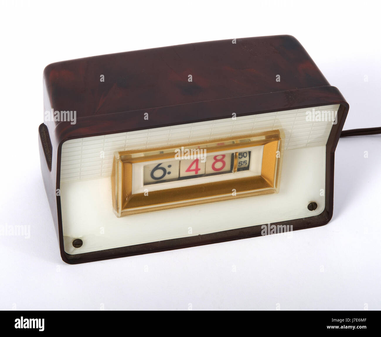 Vintage 1950's electric digital clock with bakelite cabinet. Stock Photo