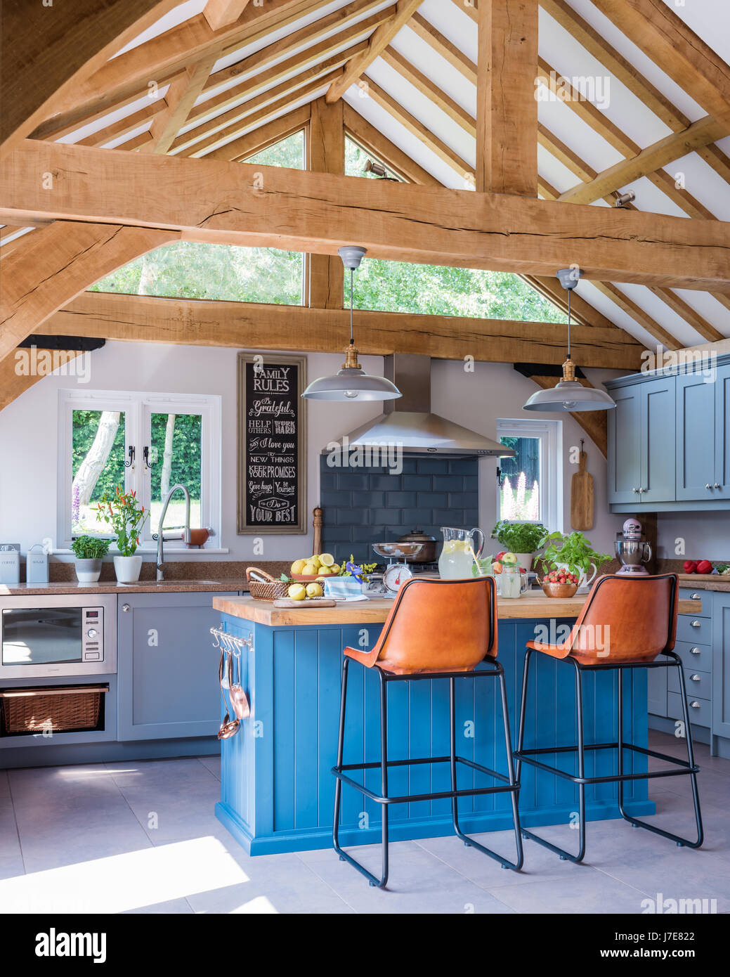 Bright island unit painted in Stiffkey Blue by Farrow & Ball in oak