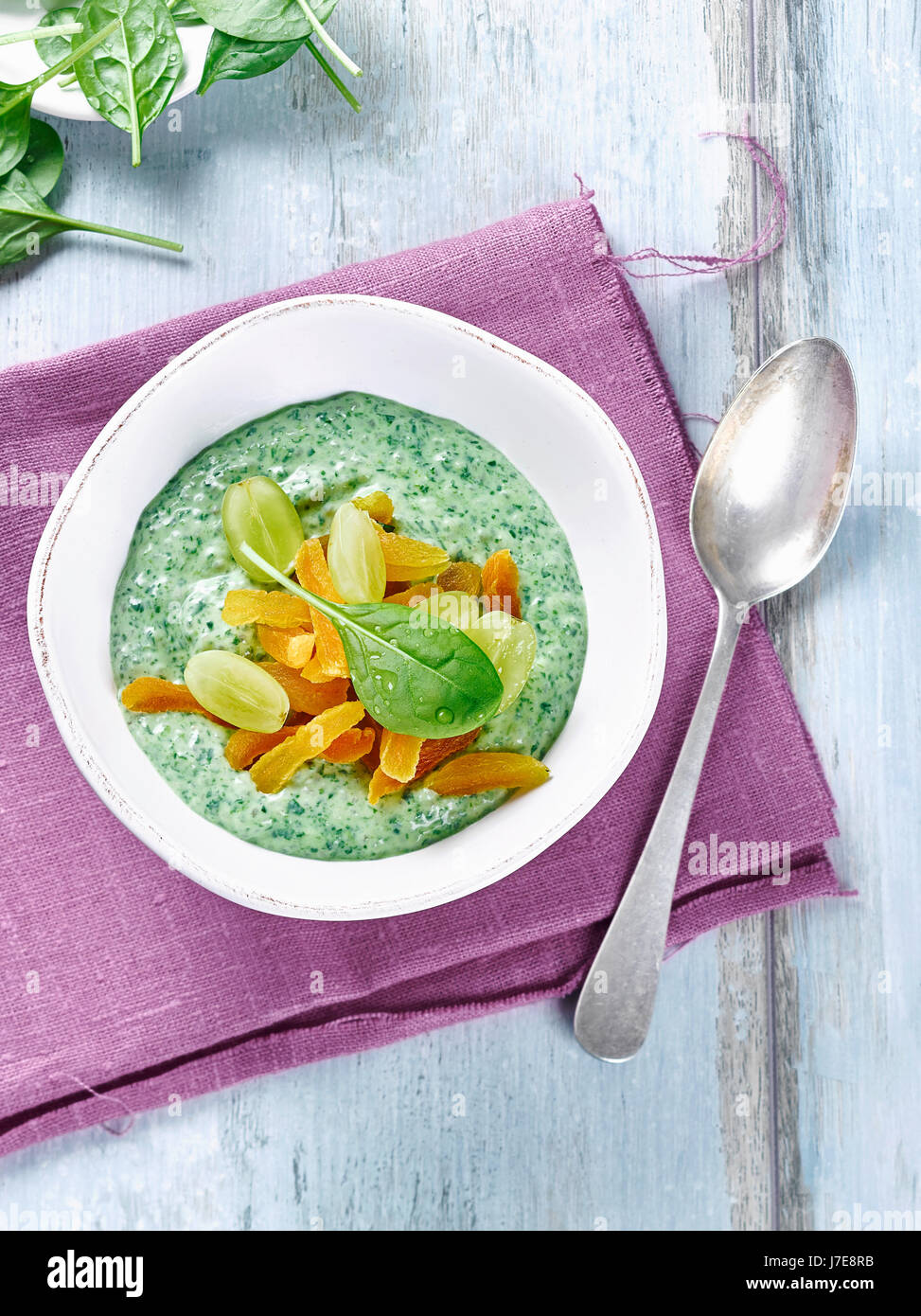 Fruity spinach smoothie bowl Stock Photo