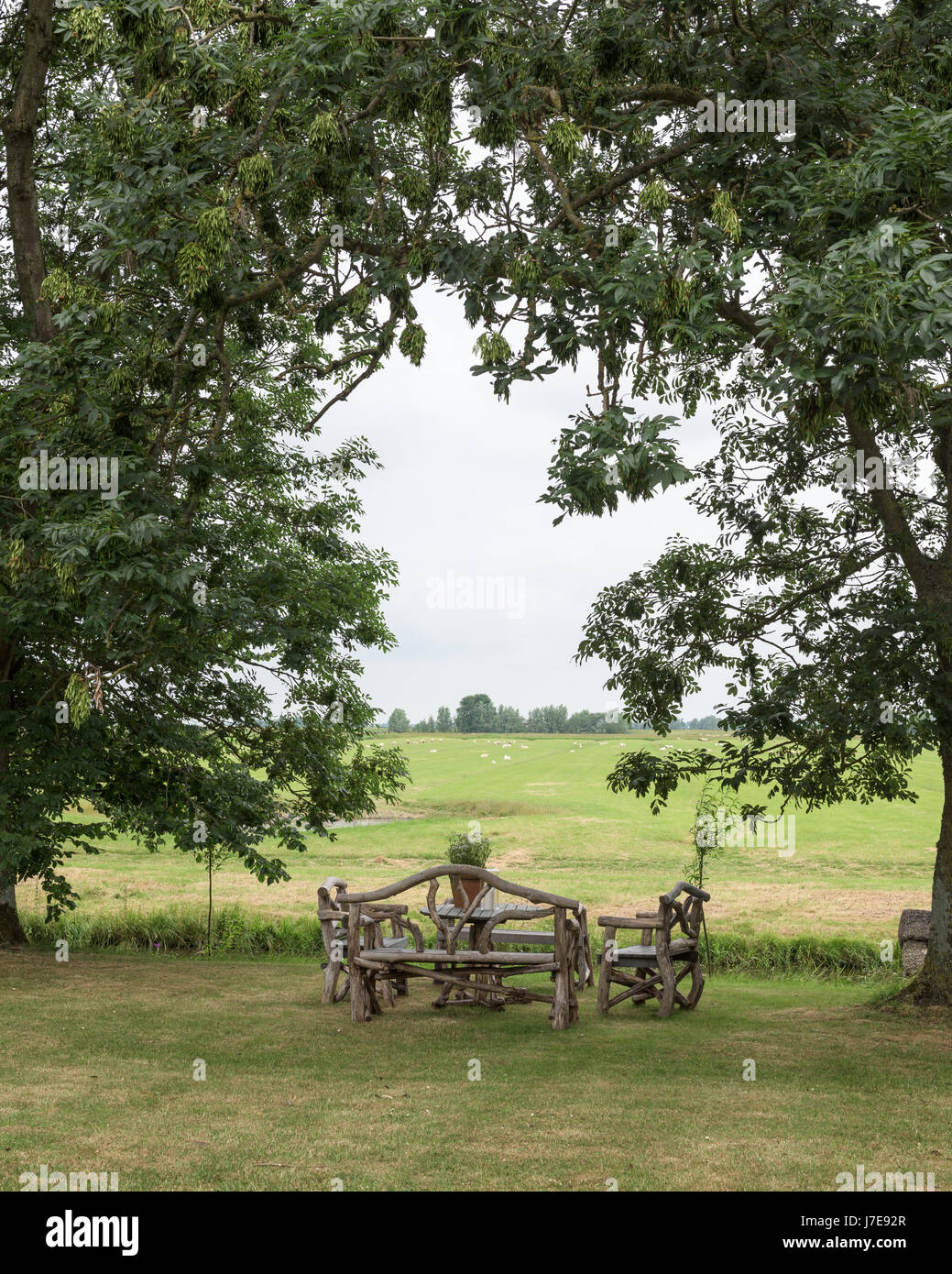 Wooden bench and table in rural countryside of Northern Germany Stock Photo