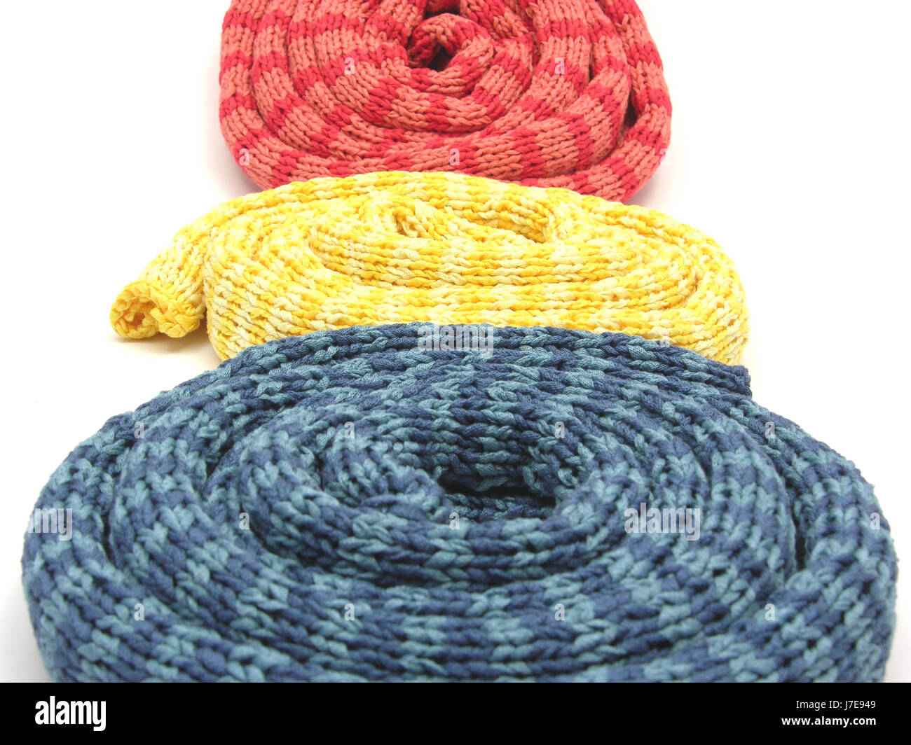 rolled three striped even knitted scarves Stock Photo