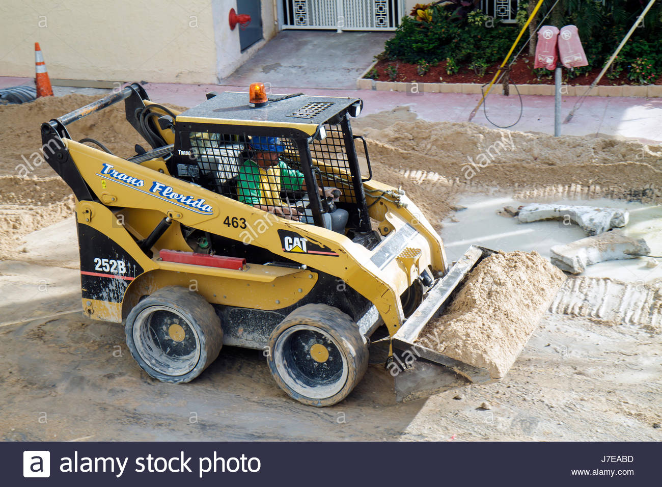 Miami Beach Florida 4th Fourth Street sewer road repair construction  upgrade skid steer loader Cat Caterpillar