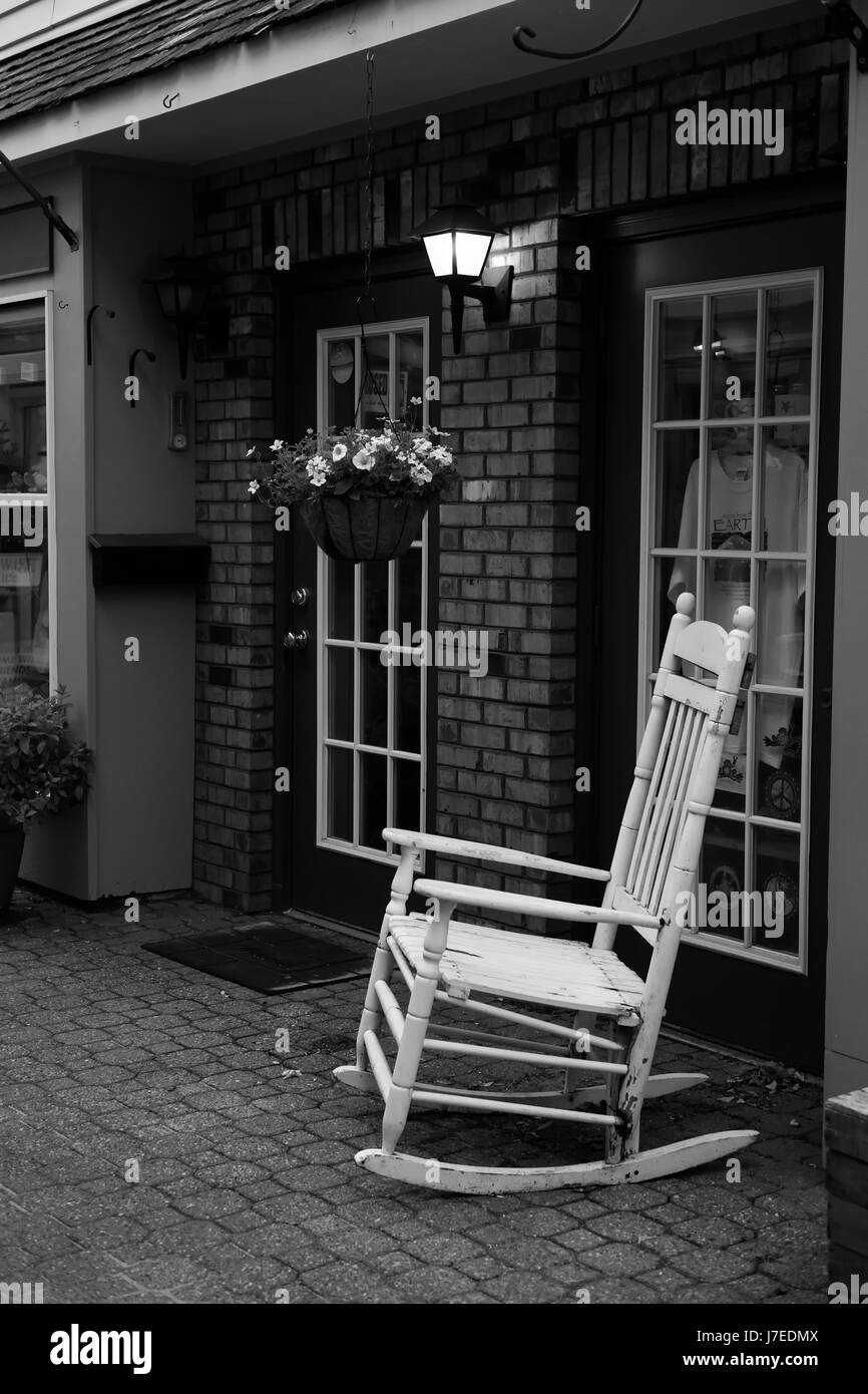 Storefront With White Rocking Chair Stock Photo