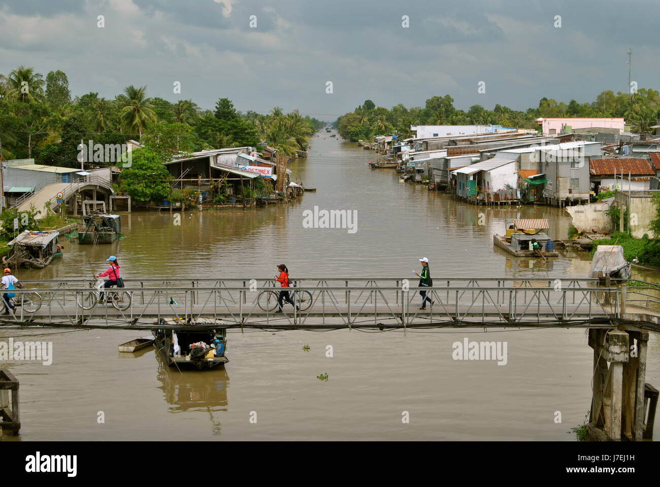 People on a bridge, Can Tho Province, Vietnam Stock Photo
