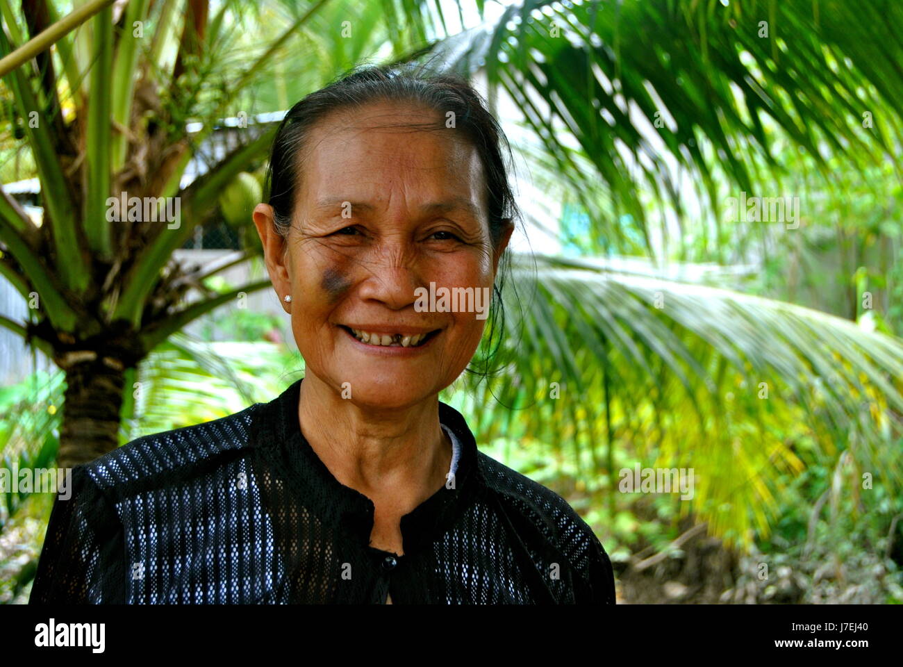 Friendly Vietnamese lady, Mekong Delta, Vietnam Stock Photo